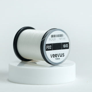 Spool of Veevus Thread Polyester 6/0 on a white background