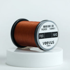 Spool of Veevus Thread Polyester 6/0 with 'veevus' branding on a white background