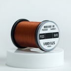 Spool of Veevus Thread Polyester 6/0 with 'veevus' branding on a white background