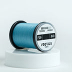 Spool of blue Veevus Thread Polyester 6/0 with Veevus branding on a white background