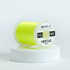 Spool of yellow Veevus Thread Polyester 6/0 with 'veevus' branding on a white background