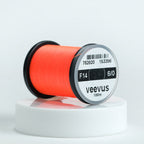 Spool of red Veevus Thread Polyester 6/0 with 'veevus' branding on a white background