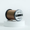 Spool of Veevus Thread Polyester 6/0 on a white background