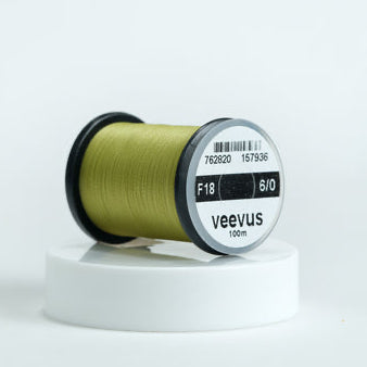 Spool of olive Veevus Thread Polyester 6/0 with 'veevus' branding on a white background