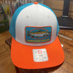 A low-profile trucker hat with a white front panel, turquoise mesh back, and bright orange brim. It features a rectangular embroidered patch of a chagrin river fish with the text 'CHAGRIN RIVER OUTFITTERS' and a white size sticker on the brim.