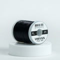 Spool of black Veevus floss on a white background