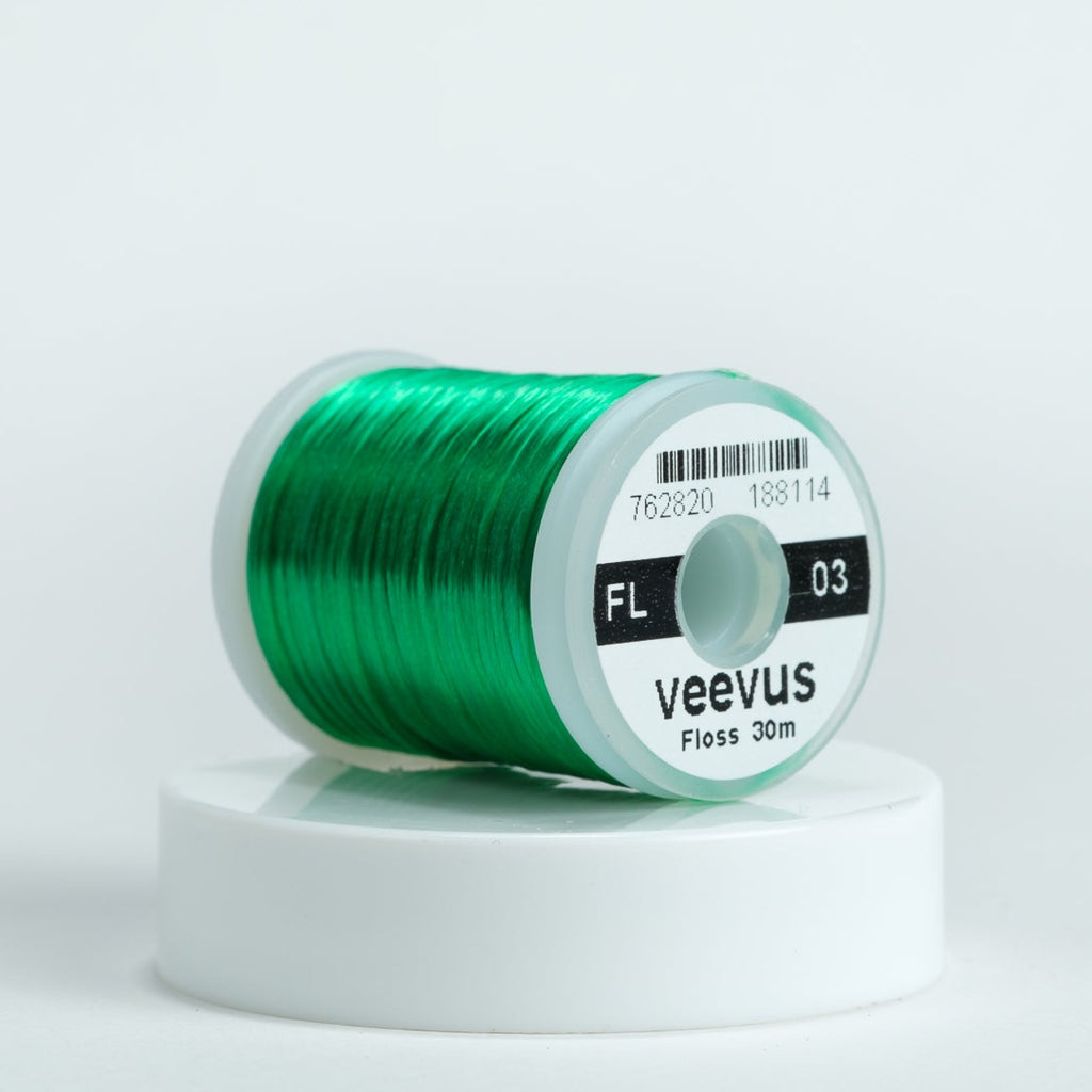 Spool of green thread with 'veevus' branding on a white background
