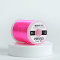 Spool of pink Veevus floss on a white background
