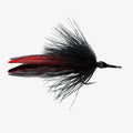 Fishing fly with black and red feathers on a white background