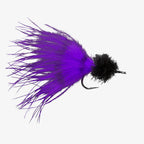 Barred purple and black tarpon fishing fly on a white background