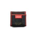 A black and red Scientific Anglers wallet with mesh construction, designed to hold fishing tips.