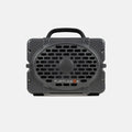 A dark gray portable speaker with a black handle and a front grille, featuring the TURTLEBOX logo in white and orange on a light gray background.