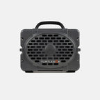 A dark gray portable speaker with a black handle and a front grille, featuring the TURTLEBOX logo in white and orange on a light gray background.