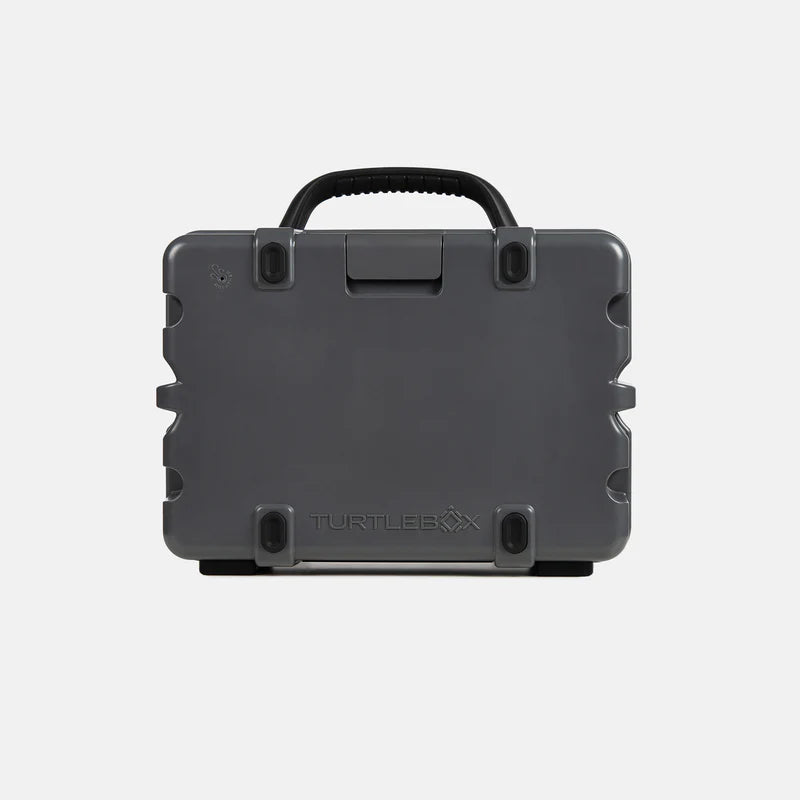 Black hard-shell of Turtlebox Original Gen 3 with handle on a light gray background