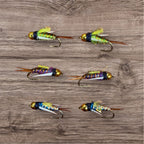A set of six colorful hand-picked Psycho Prince flies tied to size #12 hooks, displayed on a wooden surface.