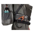 Gray Simms Dry Creek Z Backpack with orange 'Simms' logo on a white background