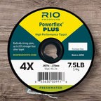 Spool of Rio Powerflex Plus High Performance Tippet on a wooden surface