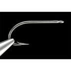 A close-up image of a single Daiichi 2546 stainless steel saltwater hook with a curved tip and a small barb, intended for fly tying.