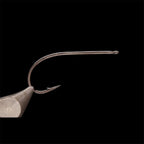 A single Kona Universal Mid-Range Streamer (UMS) hook with a barbed, straight eye, and a black-nickel finish.