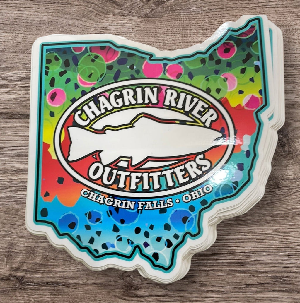 Colorful sticker with 'Chagrin River Outfitters' logo on a wooden surface