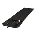 Black fishing rod case with a fishing rod inside on a white background