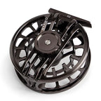 Black fishing reel on a white background