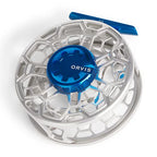 Fly fishing reel with blue and silver design on a white background