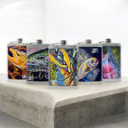 Five colorful flasks with fish designs on a white surface