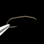 Gold-colored Daiichi 1730 fly fishing hook on a black background