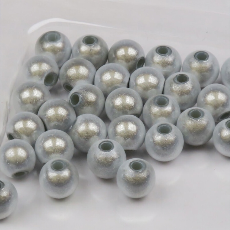 Clear Hareline 3D Beads with silver glitter on a white background