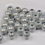 Clear Hareline 3D Beads with silver glitter on a white background