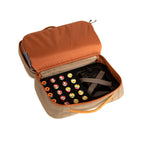 Open Fishpond beige and orange fly tying travel packing bag with gray interior on a white background