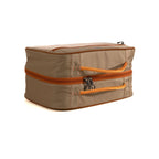 Closed Fishpond beige and orange fly tying travel packing bag with gray interior on a white background