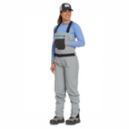 Person wearing gray Orvis women waders with suspenders on a white background