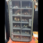 Clear fly fishing fly box with various dry fly patterns inside.