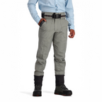 Person wearing Simms MEN's Freestone Wading Pants, a light blue shirt, and black boots on a white background