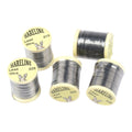 Spools of Hareline Lead Wire on a white background