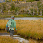 Fisherman wearing a Fishpond South Fork Wading Belt