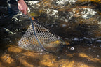 Fishing net being used in a stream