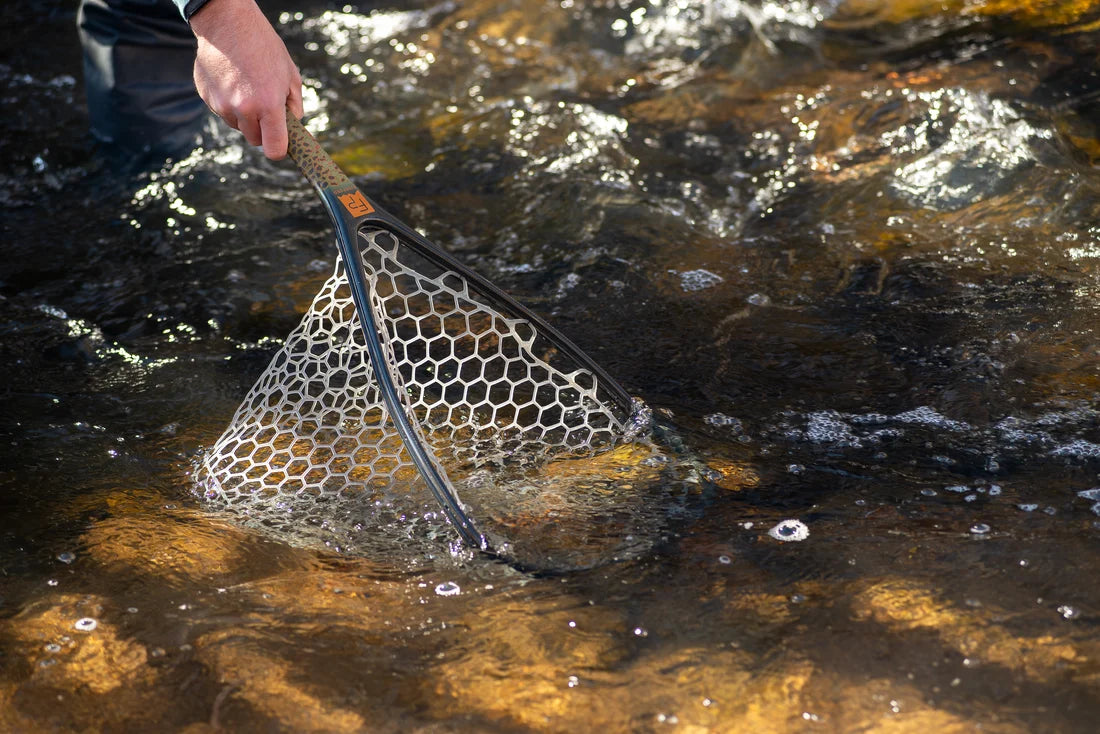 Fishing net being used in a stream