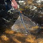Fishing net being used in a stream