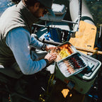 Person with a Fishpond Tacky Pescador Fly Box - XL- Dynamic Foam on a boat with a cooler nearby