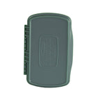 A small gray Fishpond Tacky Pescador MagPad, which is a fly fishing bait storage box, with slots for flies and a waterproof closure.