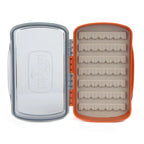 Clear plastic fly box with orange accents on a white background