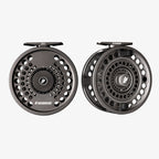Two Sage Spey II fishing reels, one in black and the other in gray, displayed side by side.