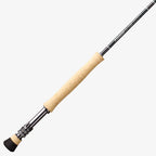 A close-up image of a Sage Salt R8 fishing rod, showing the rod's tip with a light-colored handle and black graphite body.