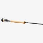 A close-up image of a Sage Salt R8 fishing rod, showing the rod's tip with a light-colored handle and black graphite body.