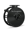 A collection of Tibor fly fishing reels in different colors displayed horizontally. The reels are labeled with their model names.