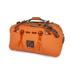 Fishpond submersible orange duffel bag with brown handles and straps on a white background