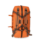 Fishpond submersible orange duffel bag with brown handles and straps on a white background